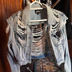 Ripped denim jacket size medium by the brand Royalty, worn once